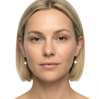 Small hoop earrings with white enamel clover pendants on stainless steel silver and gold sold in pairs